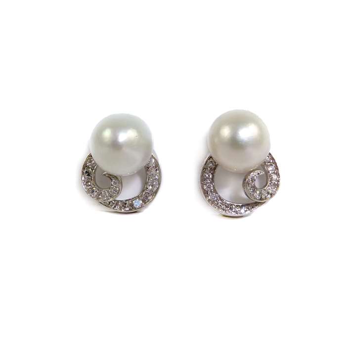 Pair of pearl and diamond scroll earrings, Monture Boucheron, Paris,